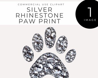 May include: Silver rhinestone paw print. This is a single image of a silver rhinestone paw print.