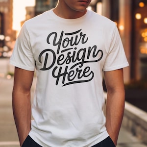 May include: A white t-shirt with the text "Your Design Here" printed in black on the front.