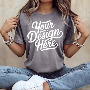 May include: A grey t-shirt with the text "Your Design Here" in white lettering.