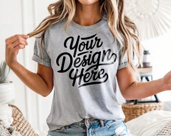 Può includere: Una maglietta grigia con il testo "Your Design Here" stampato in nero.