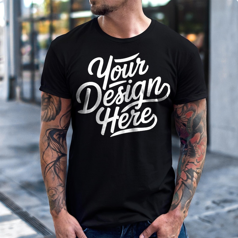May include: A black t-shirt with the text "Your Design Here" in white lettering.