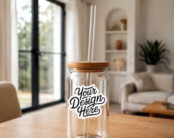 May include: A clear glass jar with a bamboo lid and a glass straw. The jar has a white sticker with the text "Your Design Here" in black.