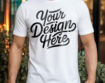 May include: White crew neck t-shirt with the text "Your Design Here" in a black script font. The shirt is short-sleeved and appears to be made of a soft material. The design is centered on the front of the shirt.
