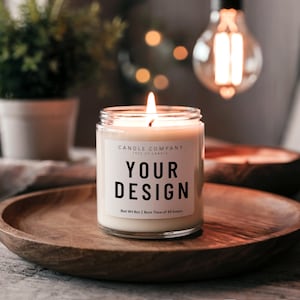 May include: A white candle in a clear glass jar with a black label that says "CANDLE COMPANY TYPE OF CANDLE YOUR DESIGN Net Wt Boz | Burn Time of 40 hours". The candle is lit and the flame is visible.