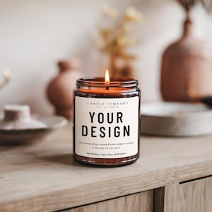 May include: A brown glass candle with a label that says "CANDLE COMPANY" and "YOUR DESIGN". The label also includes the text "Description of your candle & what makes it unique, or describe the scent here" and "Net Wt 8oz | Burn Time of 40 hours".