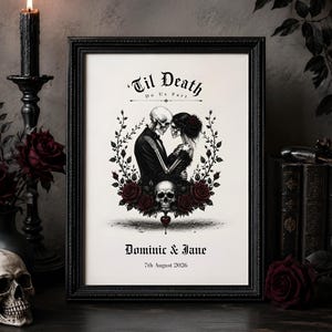 May include: A framed print featuring a skeleton couple in formal attire embracing, surrounded by a wreath of dark red roses and a skull. The text reads Til Death Do Us Part, Dominic & Jane, and 7th August 2026 in a gothic font style.