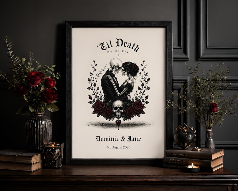 May include: A framed print featuring a black and white illustration of two skeletons embracing, surrounded by red roses and vines. The text reads 'Til Death Do Us Part', 'Dominic & Jane', and '7th August 2026'. A skull is positioned below the skeletons.