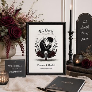 May include: A framed print featuring a skeleton couple in a black suit and dress, with the text 'Til Death Do Us Part', 'Connor & Rachel', and '15th September 2026'. The illustration includes a skull, dark red roses, and black foliage.