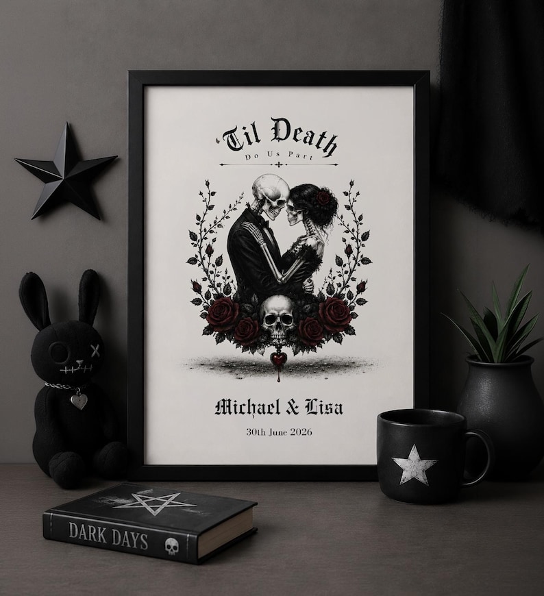 May include: A framed wall art print featuring a black and white illustration of two skeletons embracing, surrounded by red roses and a skull. The text reads 'Til Death Do Us Part' at the top and 'Michael & Lisa' with '30th June 2026' at the bottom.