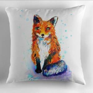May include: A watercolor painting of a red fox with green eyes sitting on a white background with blue and green watercolor splatters.
