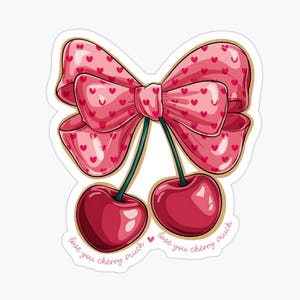 Könnte beinhalten: Zwei rote Kirschen mit grünen Stielen und einer rosafarbenen Schleife mit weißen Herzen. Die Kirschen haben den Text "love you cherry much" um sie herum geschrieben.