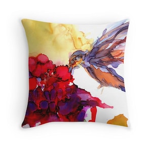 May include: A colorful abstract painting of a bird in flight, with a splash of red, purple, and yellow paint. The bird is flying towards a cluster of red and purple flowers.