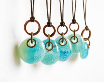 Glass drop necklaces with mixed metal copper and brass rings, one of a kind assortment of green blue patina kiln fired fused glass pendants