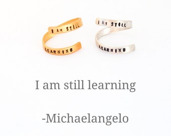 Quote Ring "I AM STILL LEARNING" by Michaelangelo Sterling silver or gold vermeil. Handcrafted by Chocolate and Steel, adjustable wrap ring