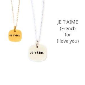 Quote Je T'Aime necklace, French for "I love you".  Handcrafted by Chocolate & Steel, handstamped necklace recycled silver and gold vermeil