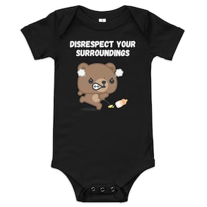 May include: Black baby bodysuit with the text "DISRESPECT YOUR SURROUNDINGS" in white. The bodysuit features a cartoon bear with an angry expression, holding a bottle. The bear is brown with white steam clouds above its head.