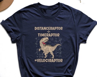 May include: A navy blue t-shirt with a graphic of a dinosaur and the text "DISTANCERAPTOR / TIMERAPTOR = VELOCIRAPTOR".