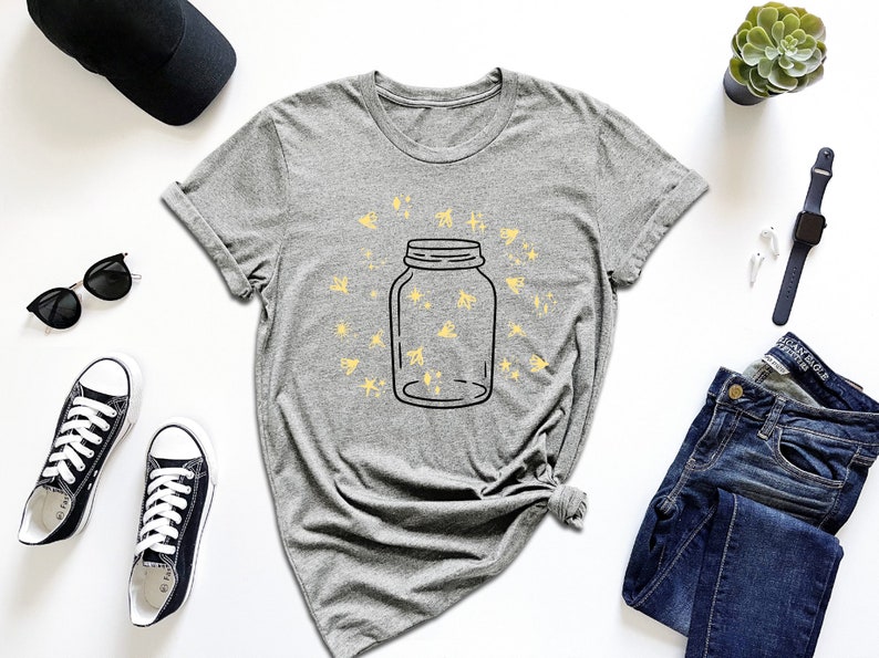 a t - shirt with a jar of stars on it
