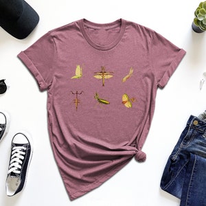 a t - shirt with a picture of birds on it