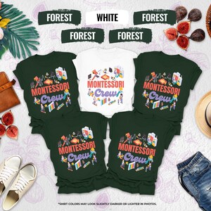 May include: A collection of t-shirts in white and forest green, each featuring the text "MONTESSORI Crew" in a colorful design. The shirts are surrounded by figs, a straw hat, and a leather bag, suggesting a lifestyle theme.