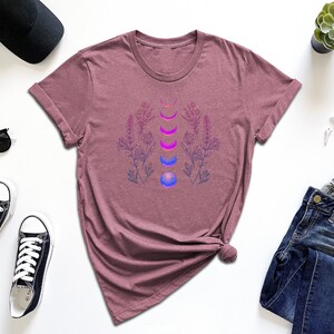 a women's t - shirt with a flower design on it