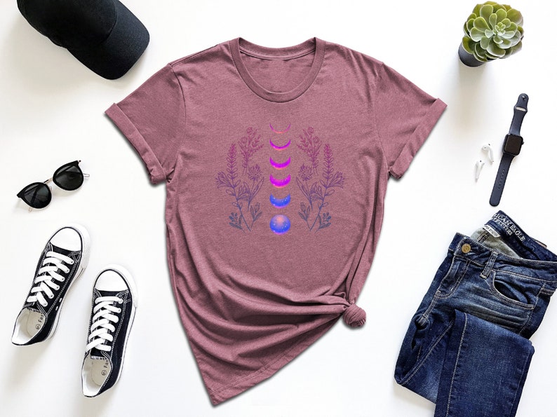 a women's t - shirt with a flower design on it