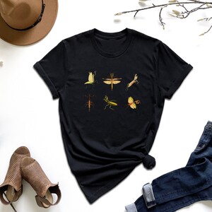 a t - shirt with a picture of a group of birds on it