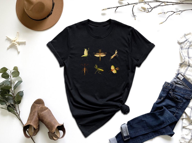 a t - shirt with a picture of a group of birds on it