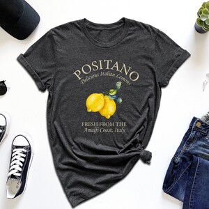 a t - shirt with a picture of two lemons on it