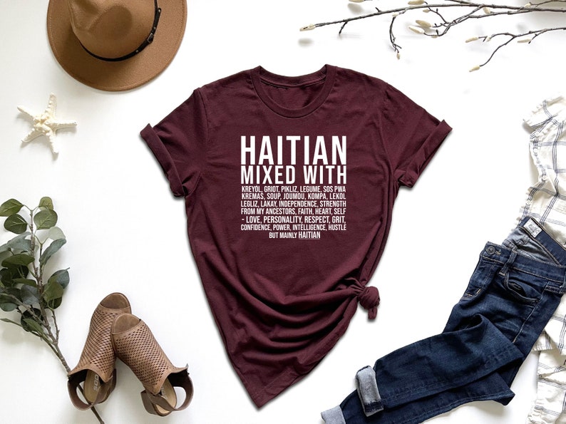 a t - shirt with the words, hat, jeans, and a pair of