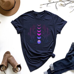 a women's t - shirt with an image of three stacked objects