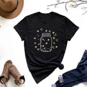 a t - shirt with a jar of stars on it