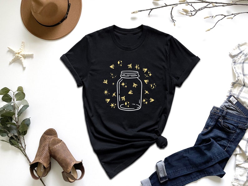 a t - shirt with a jar of stars on it