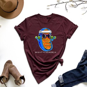 a t - shirt with a picture of a man wearing sunglasses