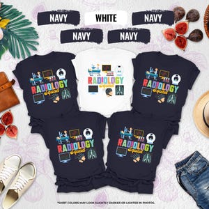 May include: Navy and white t-shirts with a "Radiology Squad" design. The design includes medical equipment, a brain scan, and a skeleton. The shirts are displayed with a leather bag, shoes, and a straw hat.