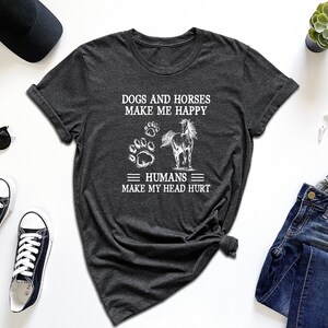 a t - shirt that says dogs and horses make me happy humans make my heart