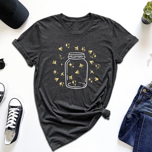 a t - shirt with a jar of stars on it