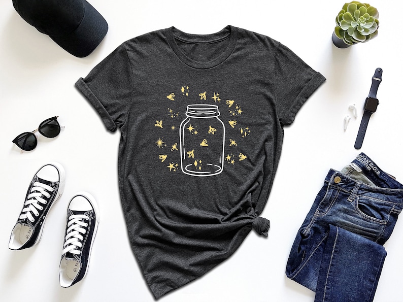 a t - shirt with a jar of stars on it