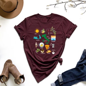 a women's t - shirt with a graphic of different things on it