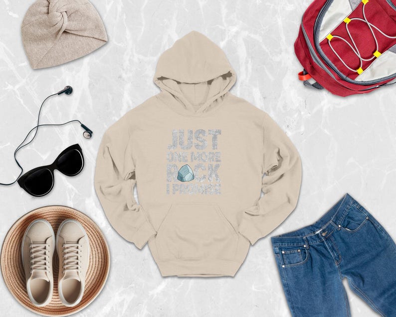 a white hoodie, jeans, a pair of sneakers, a backpack, and