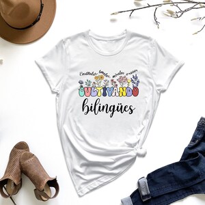 a t - shirt with the words, be kind of weird, surrounded by a