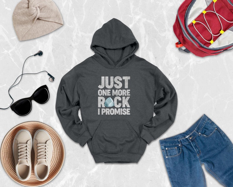 a hoodie, a pair of jeans, a pair of sneakers, and a