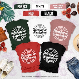 May include: A flat lay featuring six t-shirts in various colors: forest green, white, heather mauve, red, and black. Each shirt has a circular graphic with the text "Making a Difference #Neuro Squad". The image includes figs, a hat, and a leather bag.
