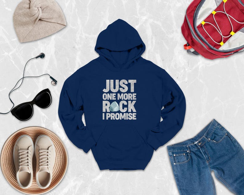 a blue hoodie that says just one more rock i promise