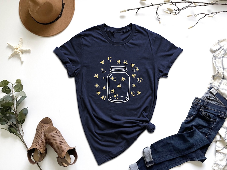 a t - shirt with a jar of honey on it