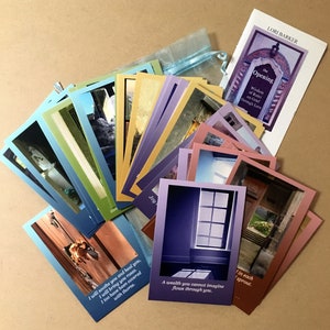 May include: A set of colorful cards with inspirational quotes and images of windows and doors. The cards are arranged in a fan shape on a brown surface. The text on the cards includes "The Opening", "Wisdom of Rumi on Grief through Love", "I will soothe you and heal you, I will bring you roses. I too have been covered with thorns.", "A wealth you cannot imagine flows through you.", and "in each sprout."