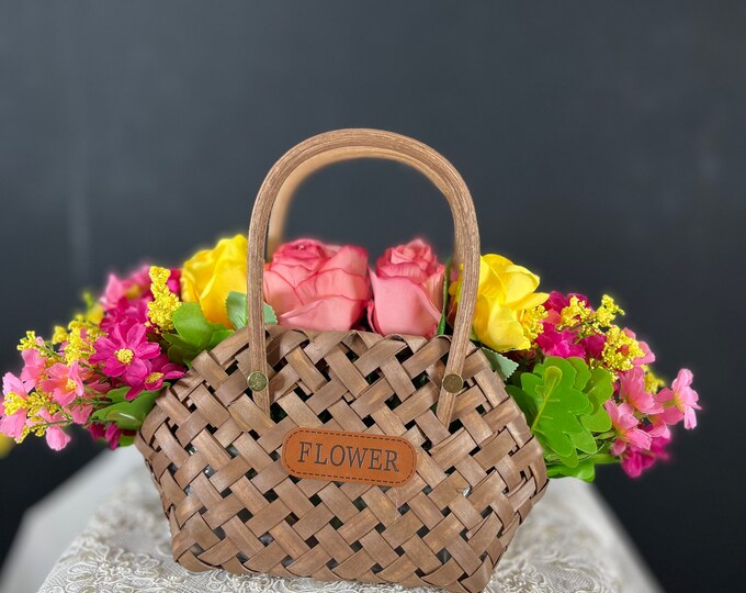 Yellow and Pink Roses, Daisies, assorted greenery arrangement in a quaint wicker basket