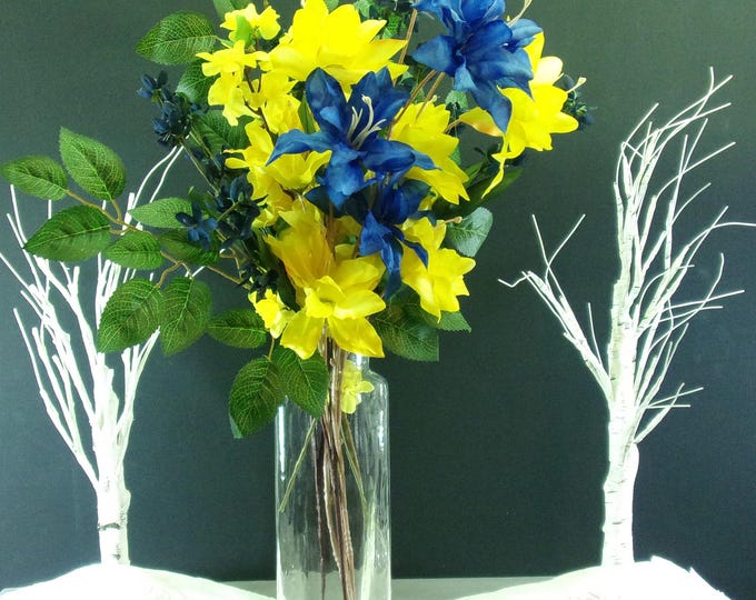 Sapphire Sunrise, Flame Lilies, Cherry Blossoms, and a Banyan Branches in a Tall Square Glass Vase with Clear and Amber glass marbles