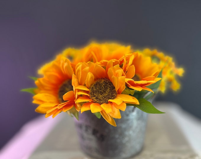 Large & small Sunflowers in a rustic metal pail