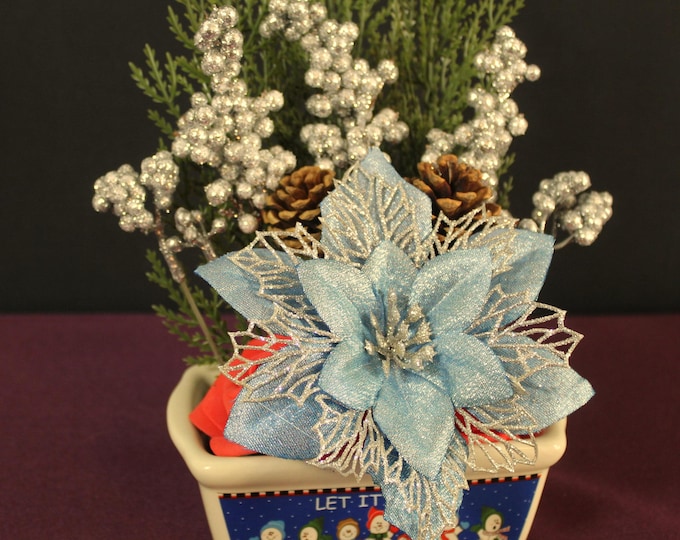 Luxury Floral Tabletop Arrangement, Decorative Snowman Vase with Blue Poinsettias, Red Roses & Frosted Pine Accents
